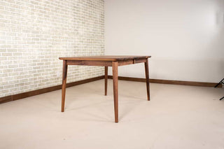 extendable mid century table made of walnut