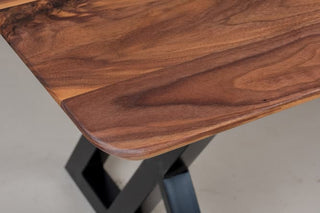Walnut dining table on steel legs.