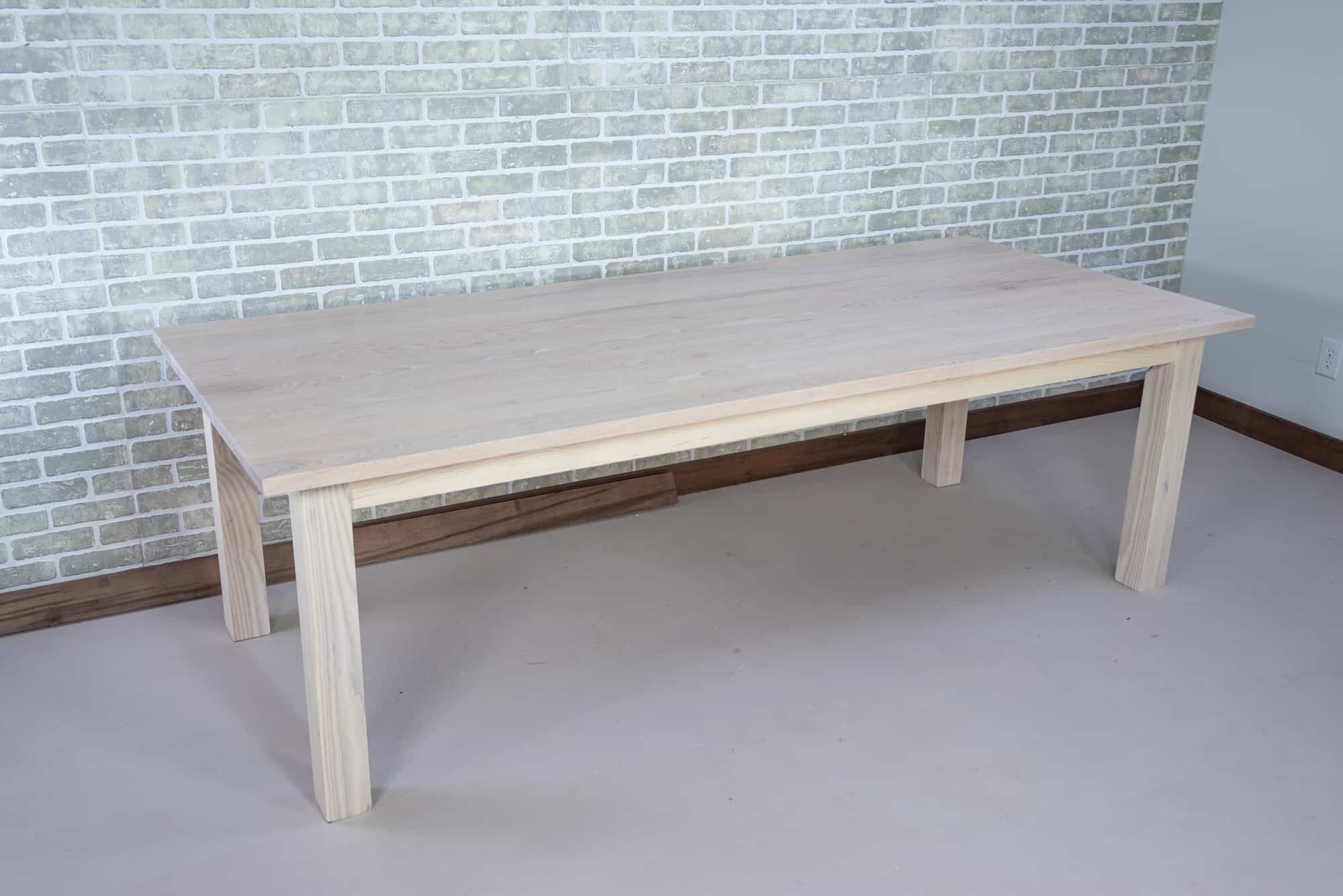 large white wood parsons table