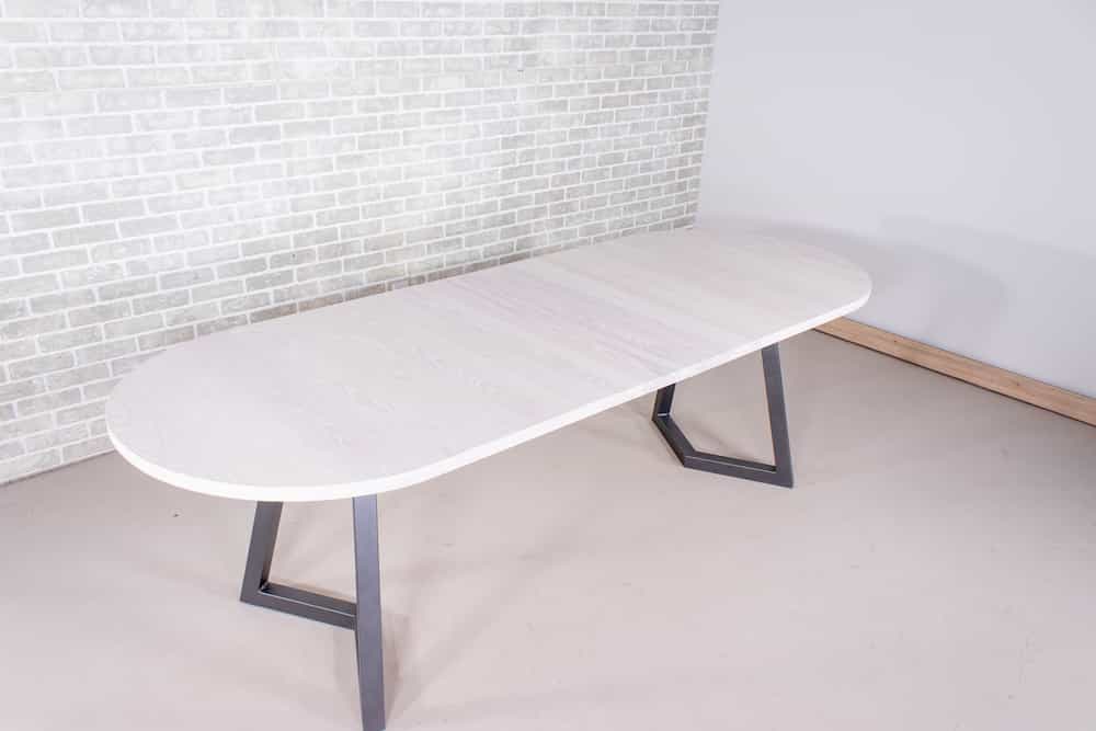 white oval extendable table on gunmetal steel legs