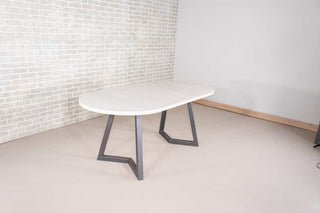 white oval extendable table on gunmetal steel legs