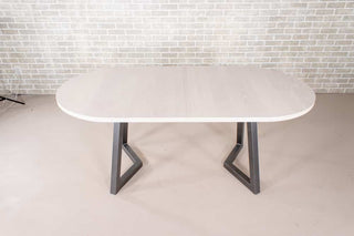 white oval extendable table on gunmetal steel legs