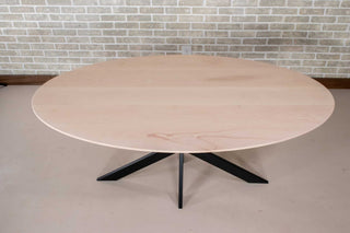 oval table on steel starburst base