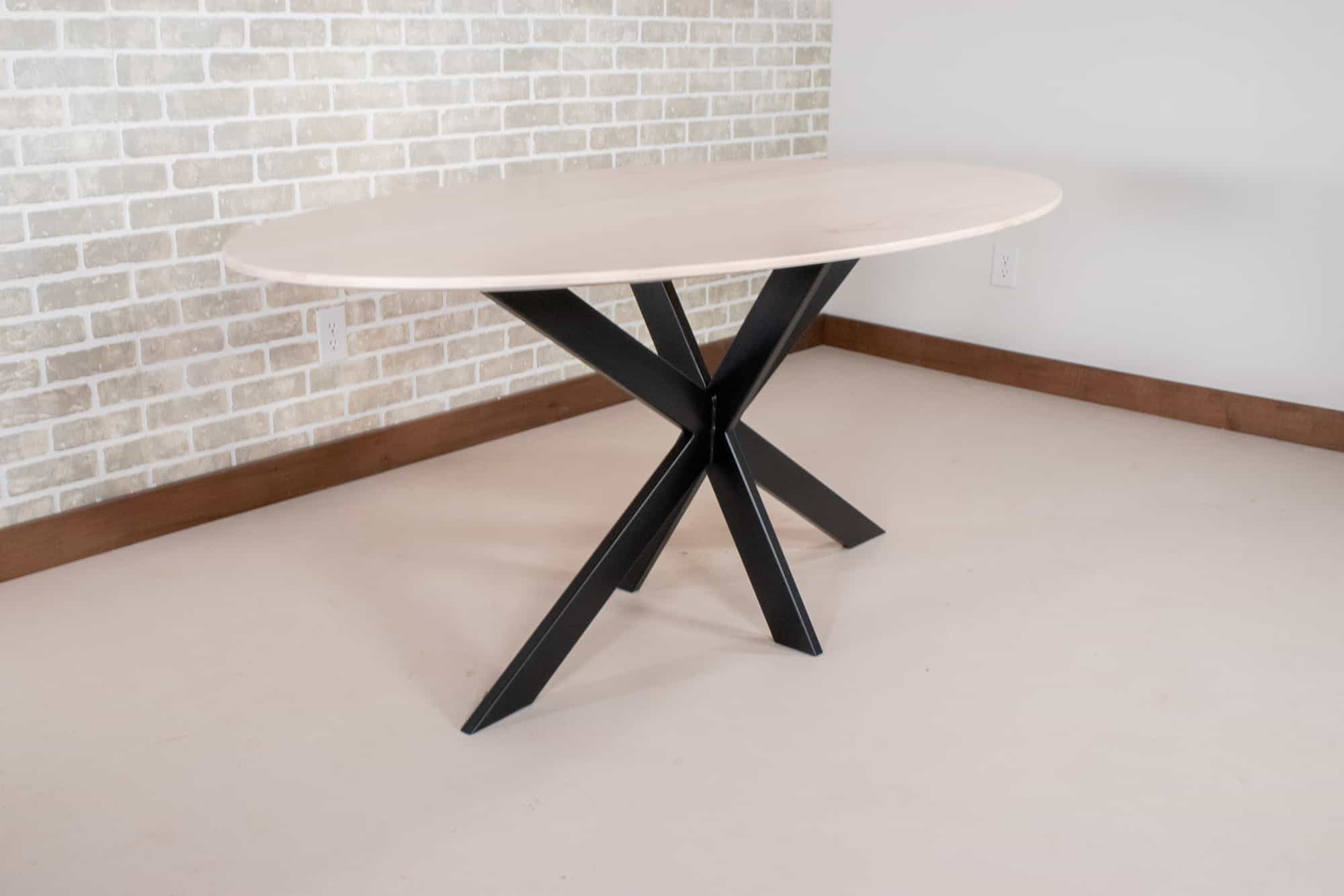 oval table on steel starburst base