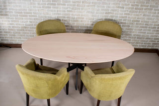 oval table on steel starburst base