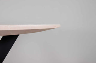 oval table on steel starburst base
