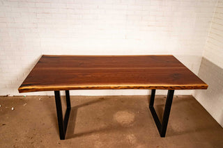 bookmatch live edge walnut table on atlin leg