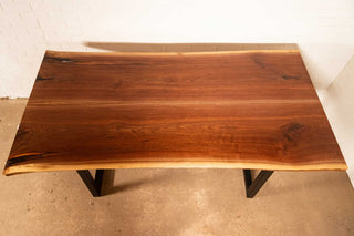 bookmatch live edge walnut table on atlin leg