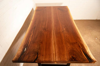 bookmatch live edge walnut table on atlin leg