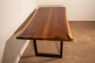 bookmatch live edge walnut table on atlin leg