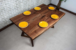 calm live edge walnut table on walnut legs