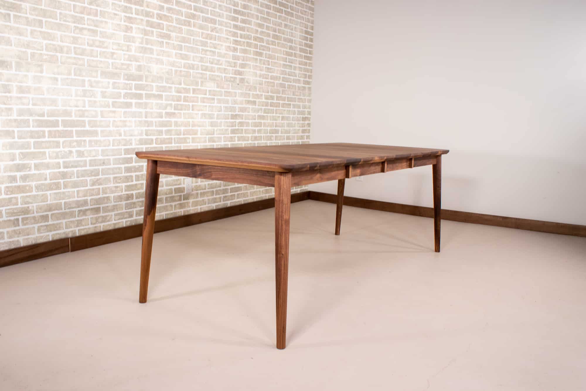 extendable mid century table made of walnut