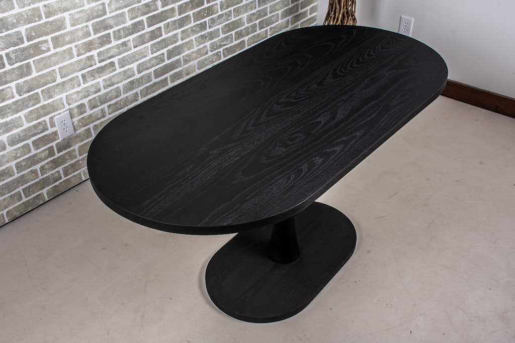 Black stained ash racetrack oval Jarvis dining table.
