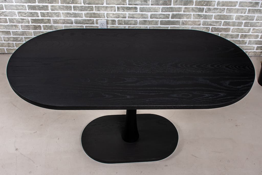 Black stained ash racetrack oval Jarvis dining table.