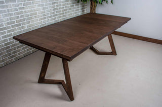 Dark wood extendable dinner table.