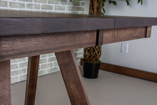Dark wood extendable dinner table.