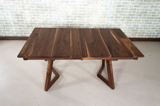 walnut center extension table on wood legs