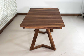walnut center extension table on wood legs