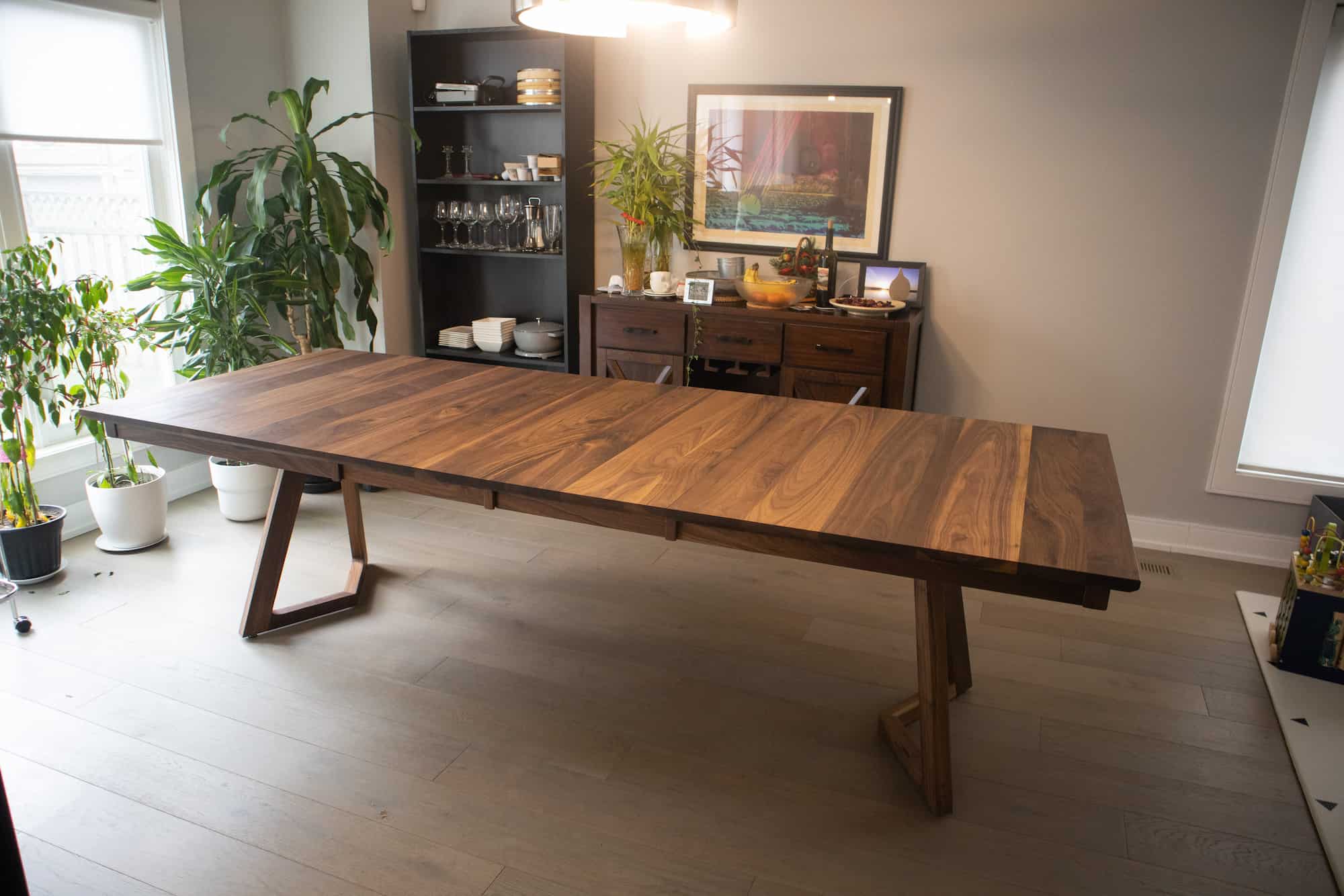 walnut center extension table on wood legs