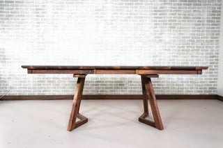 walnut center extension table on wood legs