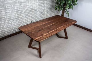 midcentury modern table in walnut with rounded corners