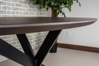 maple oval dinner table in espresso on starburst pedestal base