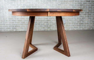 round walnut center extension table with square edge on wood legs