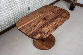 small walnut table on pedestal base