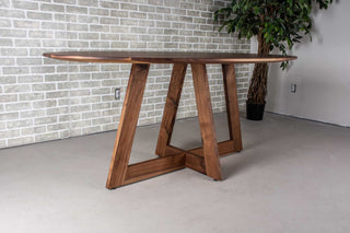 walnut ellipse table with thin edge on cross base