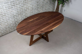 walnut ellipse table with thin edge on cross base