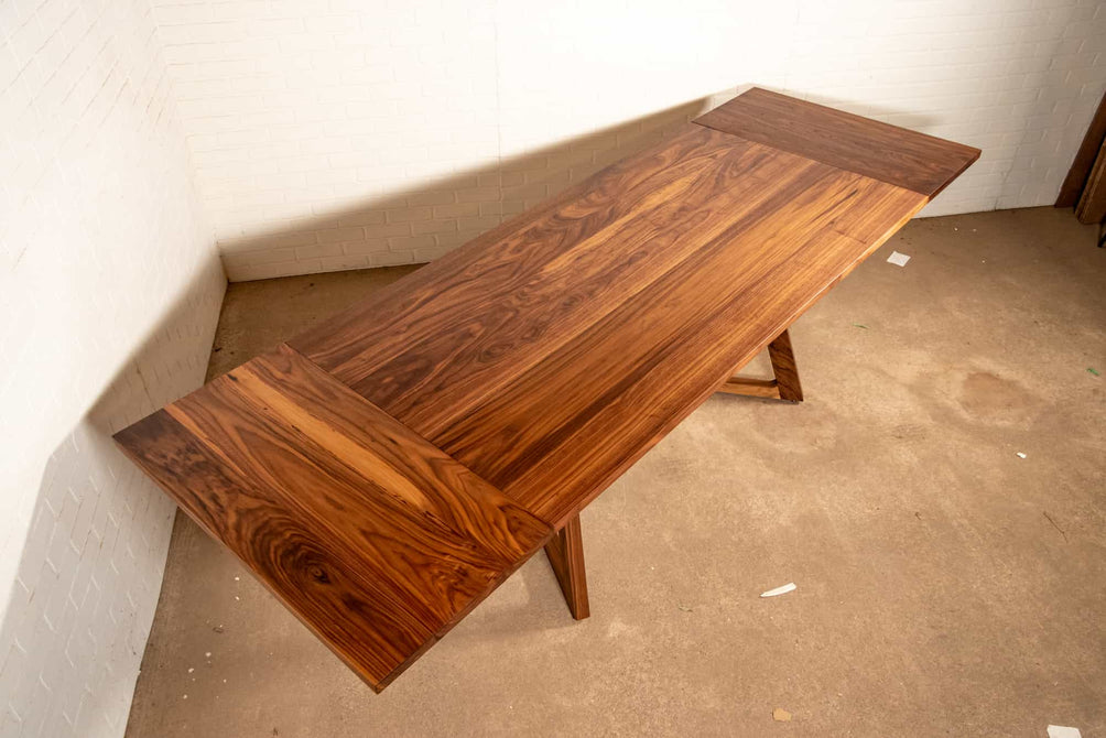 walnut end extension table with square edge on wood legs