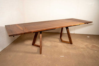 walnut end extension table with square edge on wood legs