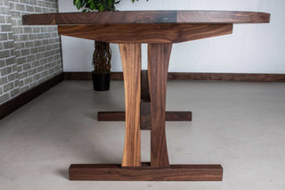 walnut oval table on custom trestle pedestal