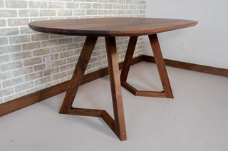 oval walnut table on wood legs