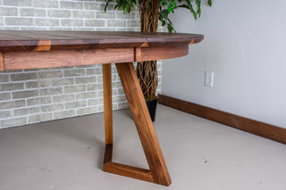 walnut round extendable table on wood legs