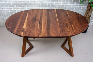 walnut round extendable table on wood legs