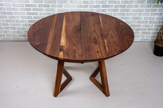 walnut round extendable table on wood legs