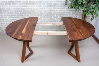 walnut round extendable table on wood legs
