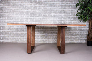 Walnut square table on square U legs.