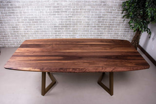 walnut squoval dining table on gold chandler legs