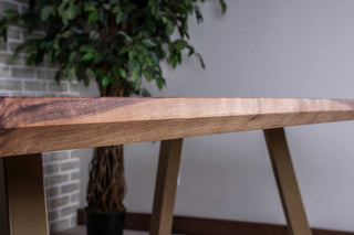 walnut squoval dining table on gold chandler legs