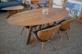 walnut elliptical oval table on single cross base